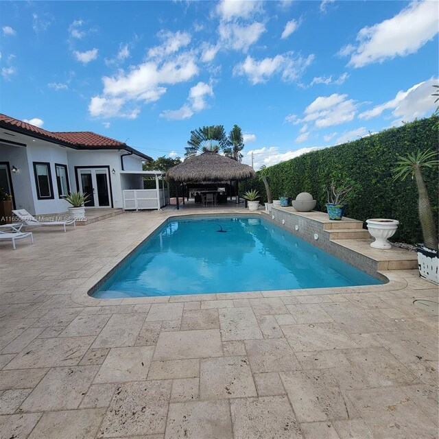 2621 SW 132nd Ave, Miami, FL 33175 - view of pool featuring a patio, a fenced in pool, a gazebo, and french doors
