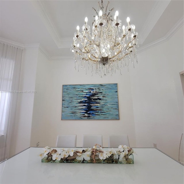 unfurnished dining area featuring a tray ceiling and crown molding