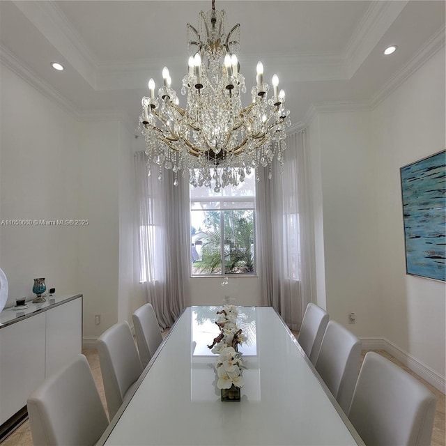 dining space with baseboards, ornamental molding, a raised ceiling, and recessed lighting