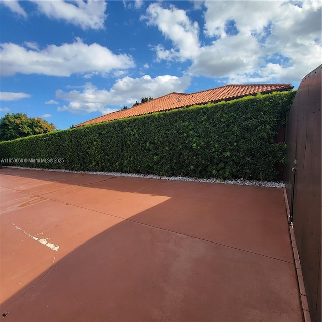 view of patio / terrace featuring fence