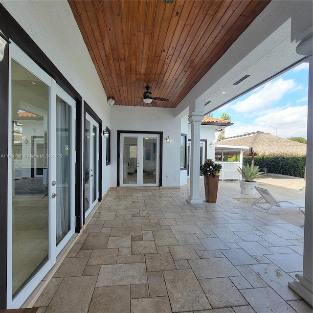 view of patio with a ceiling fan and french doors