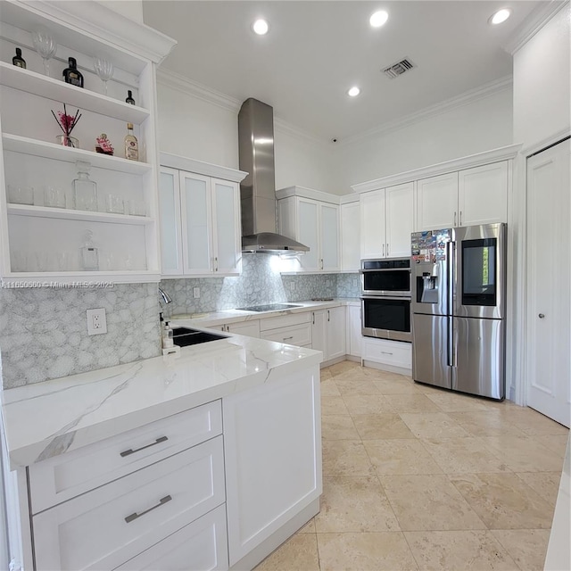 kitchen featuring visible vents, wall chimney exhaust hood, appliances with stainless steel finishes, open shelves, and a sink