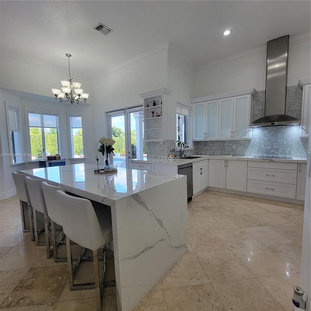 kitchen featuring visible vents, dishwashing machine, wall chimney range hood, open shelves, and backsplash