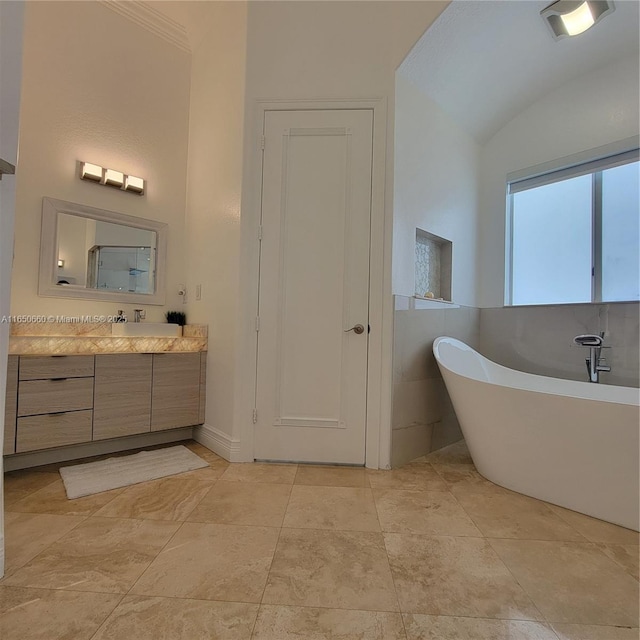 2621 SW 132nd Ave, Miami, FL 33175 - bathroom with vaulted ceiling, a freestanding tub, and vanity