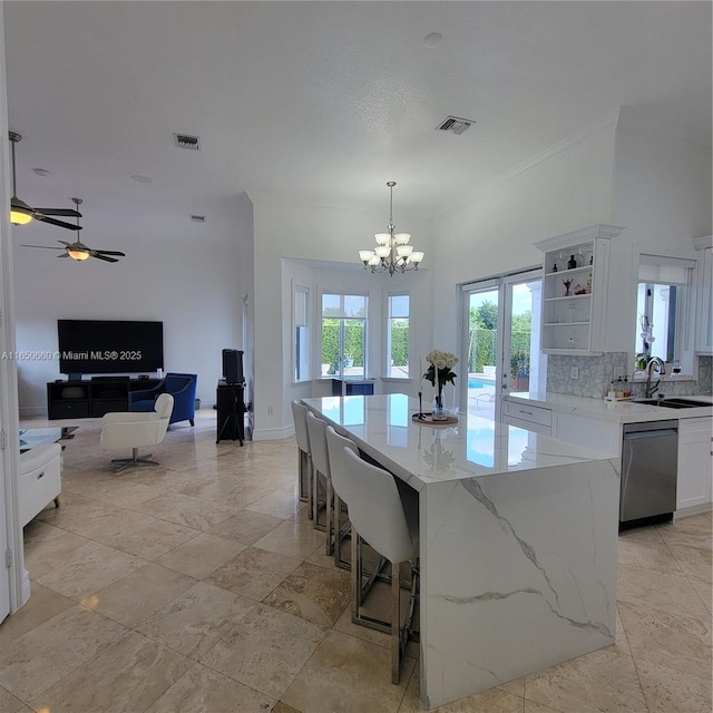 kitchen with visible vents, white cabinets, dishwasher, open shelves, and a sink