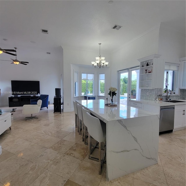 kitchen featuring a sink, visible vents, open shelves, and stainless steel dishwasher