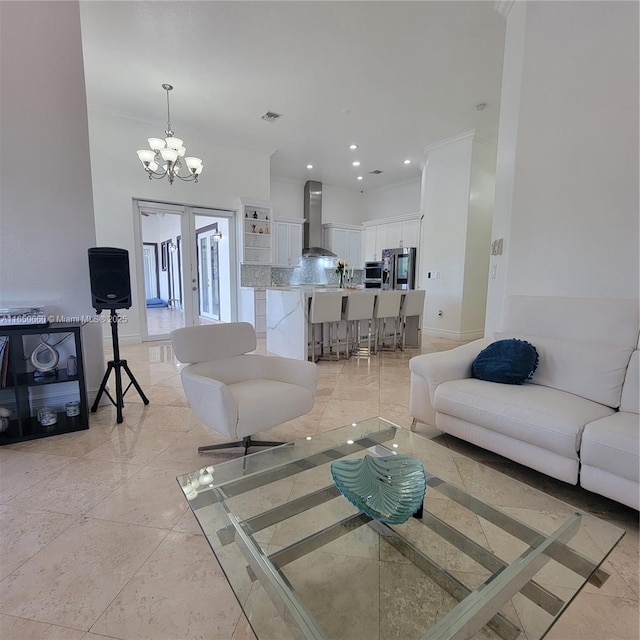 living area featuring baseboards, ornamental molding, a notable chandelier, and recessed lighting