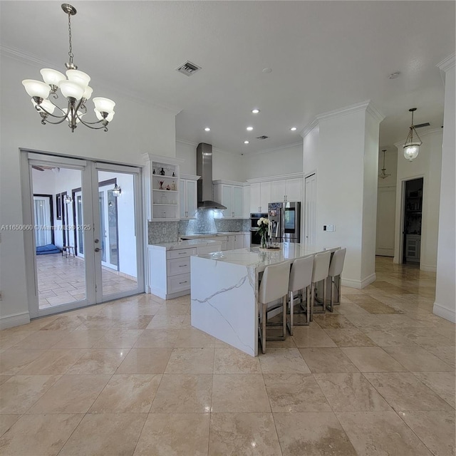 kitchen with stainless steel refrigerator with ice dispenser, open shelves, tasteful backsplash, visible vents, and wall chimney range hood