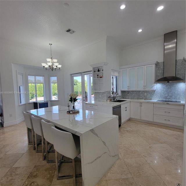 kitchen featuring visible vents, decorative backsplash, dishwashing machine, black electric cooktop, and wall chimney range hood