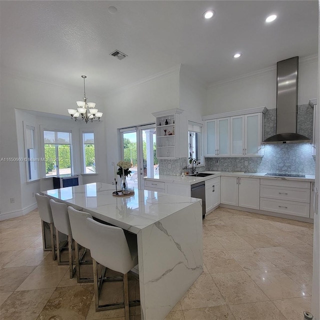 kitchen featuring open shelves, tasteful backsplash, wall chimney range hood, light stone countertops, and dishwashing machine