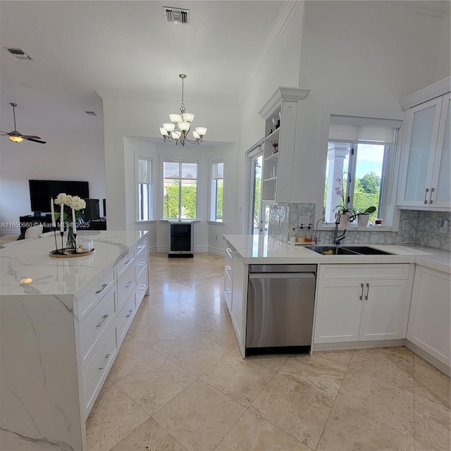 kitchen featuring dishwasher, open floor plan, a sink, and visible vents