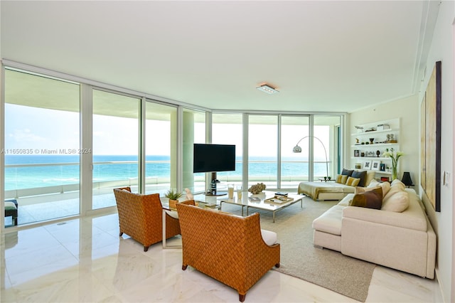 living room featuring floor to ceiling windows