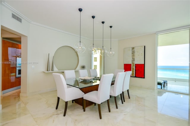 dining space with an inviting chandelier and ornamental molding