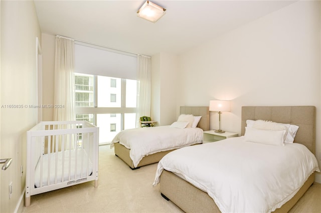 bedroom with light colored carpet