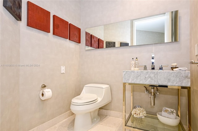 bathroom featuring toilet and tile patterned floors