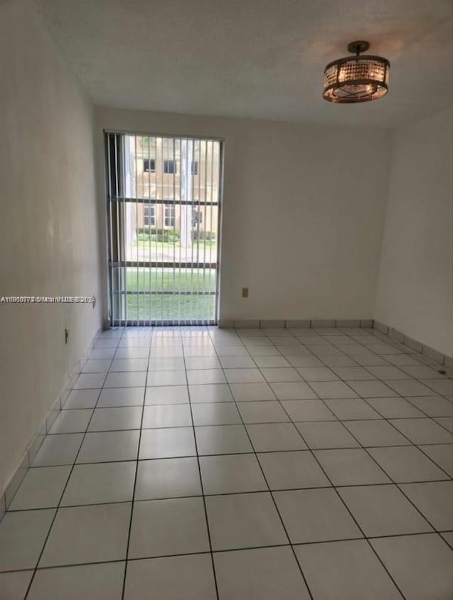 view of tiled spare room