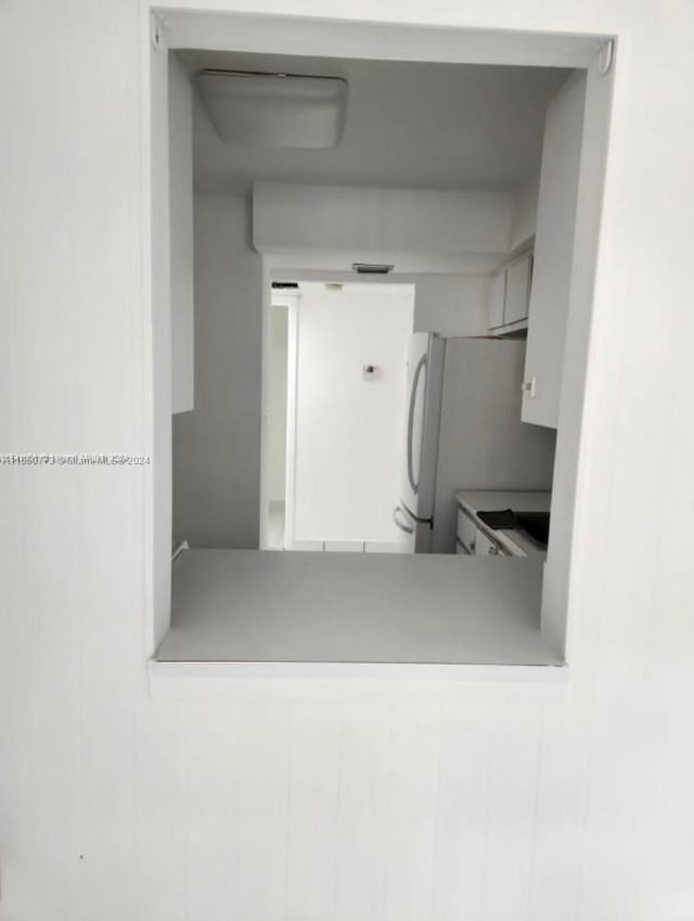 interior space featuring white refrigerator