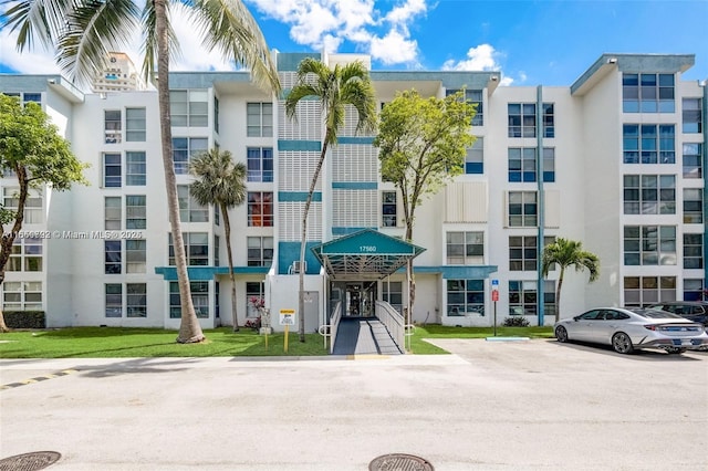 17620 Atlantic Blvd Unit 315, Sunny Isles Beach, FL 33160 - view of apartment building / complex featuring uncovered parking
