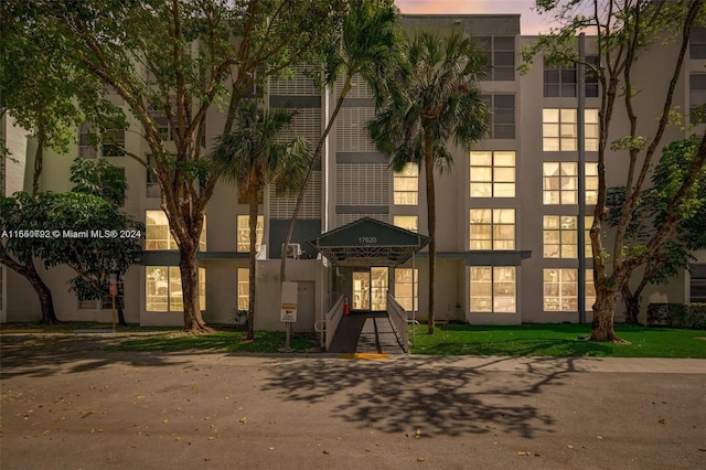 view of outdoor building at dusk