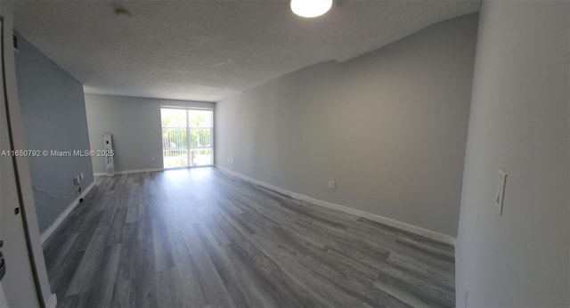 17620 Atlantic Blvd Unit 315, Sunny Isles Beach, FL 33160 - spare room featuring wood finished floors and baseboards