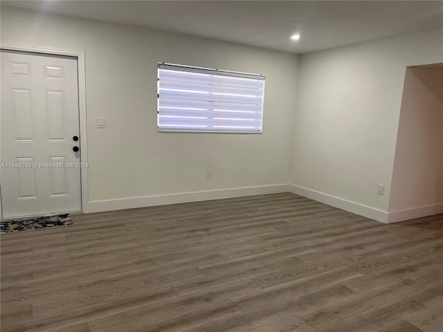 spare room featuring dark hardwood / wood-style floors