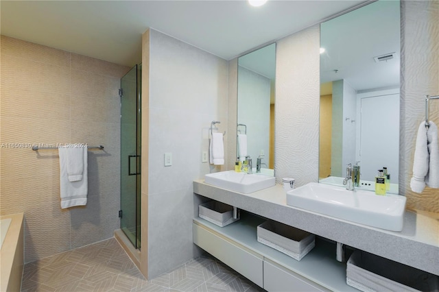 bathroom with vanity and a shower with shower door