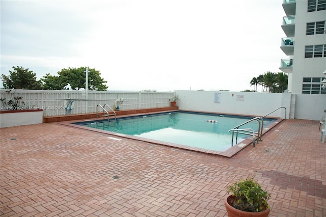 view of pool featuring a patio