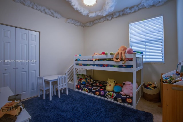 bedroom featuring a closet and carpet flooring