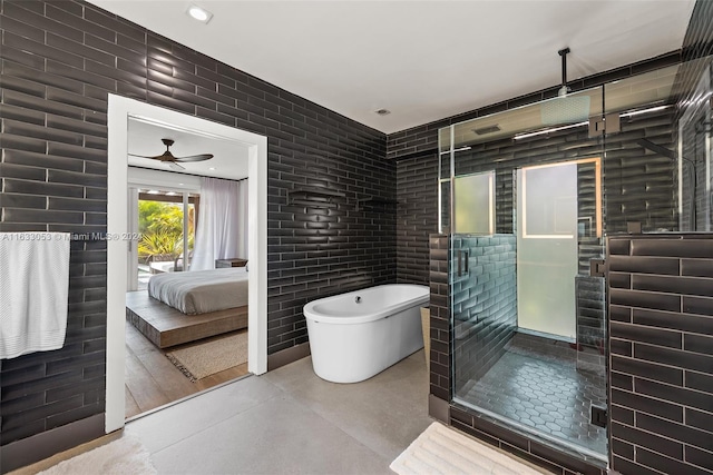 bathroom with tile walls, separate shower and tub, and ceiling fan