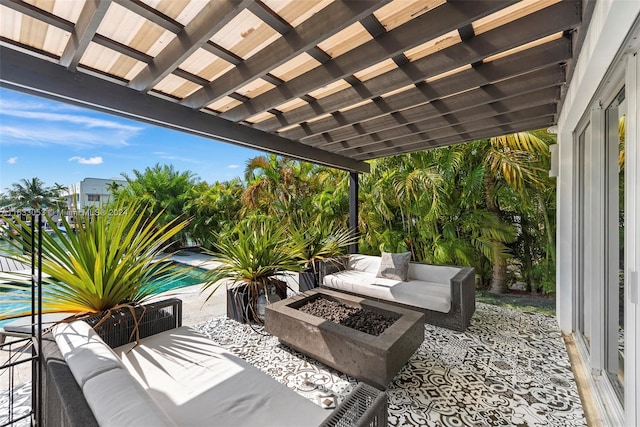 view of patio featuring an outdoor living space with a fire pit