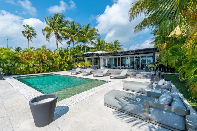 view of pool with a patio and a pergola