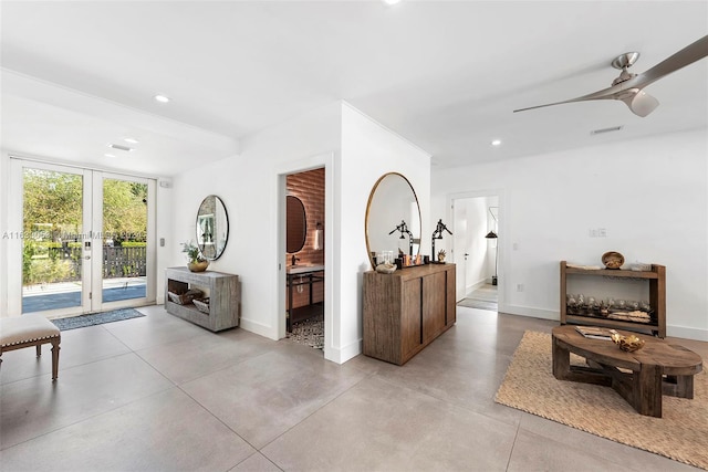 living room with french doors and ceiling fan