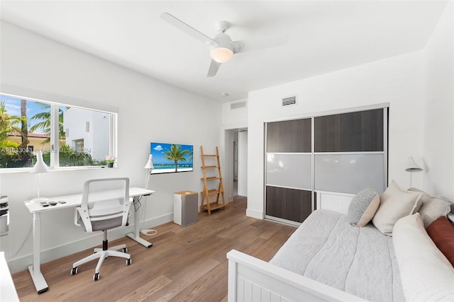 bedroom featuring ceiling fan and light hardwood / wood-style flooring