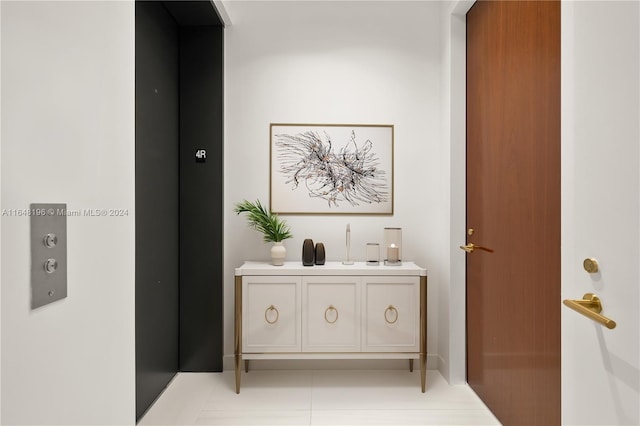 corridor featuring light tile patterned flooring