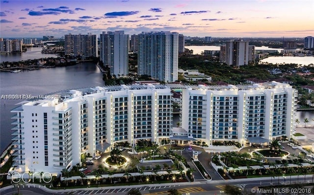 aerial view at dusk with a water view