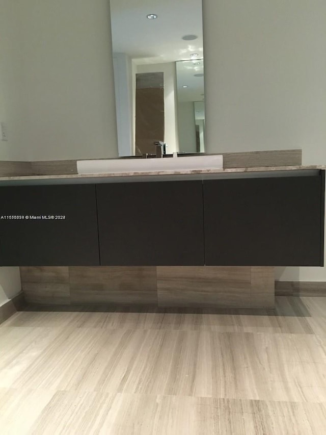 bathroom with wood-type flooring and vanity