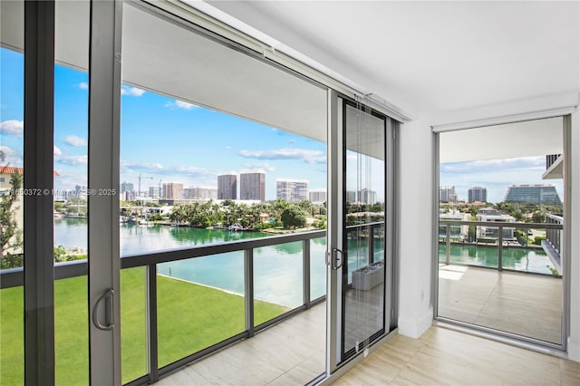 balcony with a water view and a city view