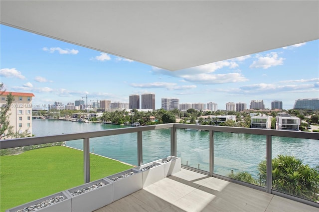 balcony with a view of city and a water view