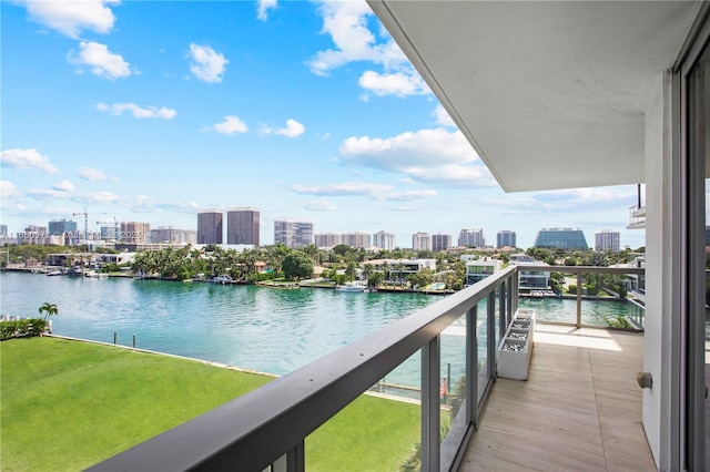 balcony with a view of city and a water view