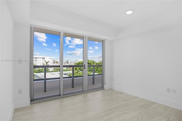 empty room featuring baseboards