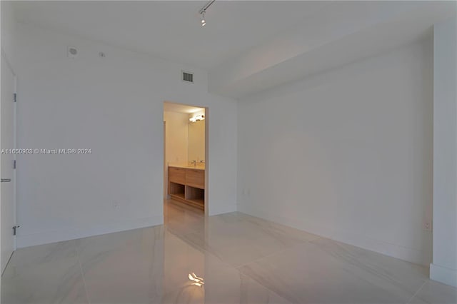 empty room with light tile patterned floors