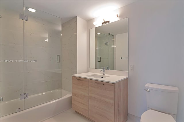 full bathroom featuring tile patterned floors, toilet, shower with separate bathtub, and vanity