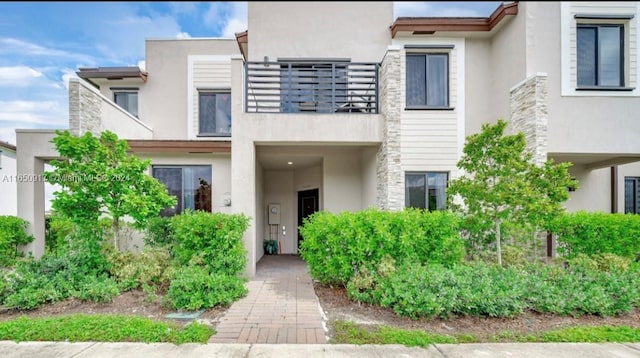 view of front of property with a balcony