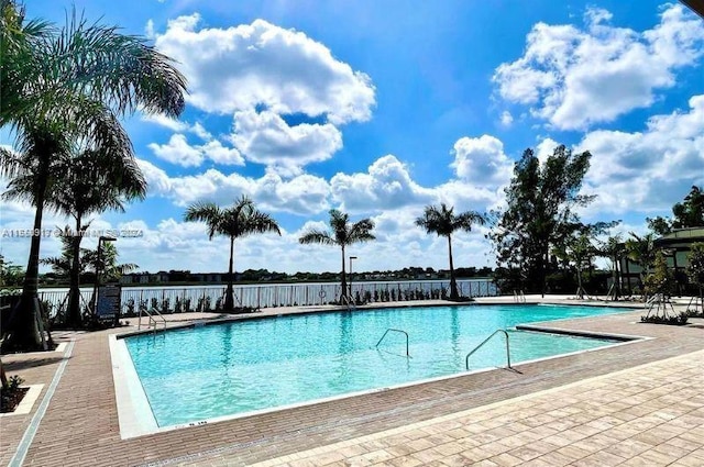 view of swimming pool featuring a patio area