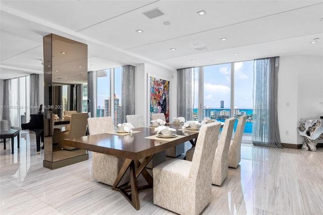 dining space with a wealth of natural light and expansive windows