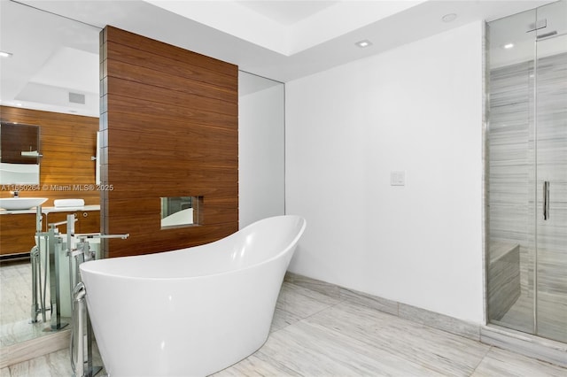 bathroom with shower with separate bathtub, tile patterned floors, and sink