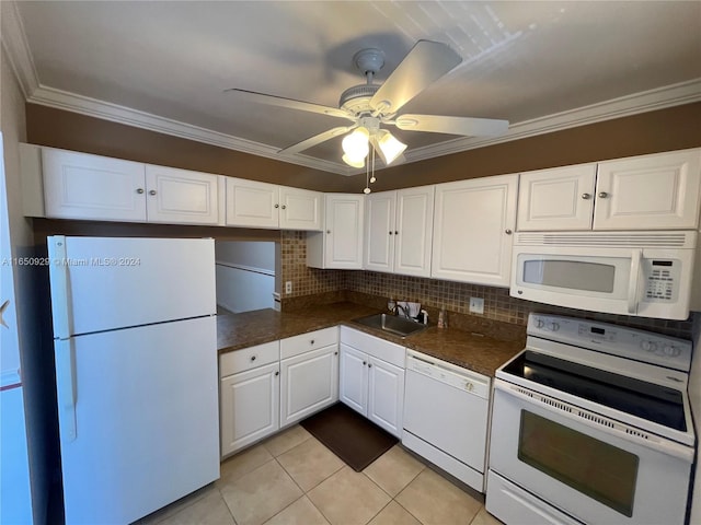 kitchen featuring white appliances, sink, ceiling fan, decorative backsplash, and white cabinets