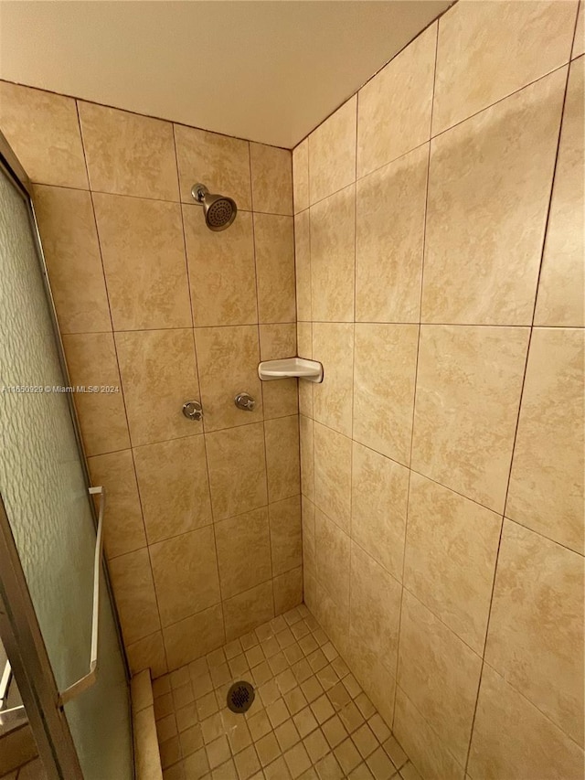 bathroom with tiled shower