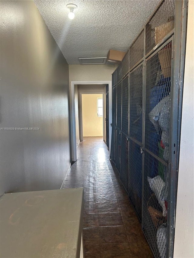 corridor with a textured ceiling