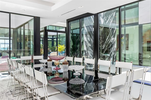 dining room with floor to ceiling windows